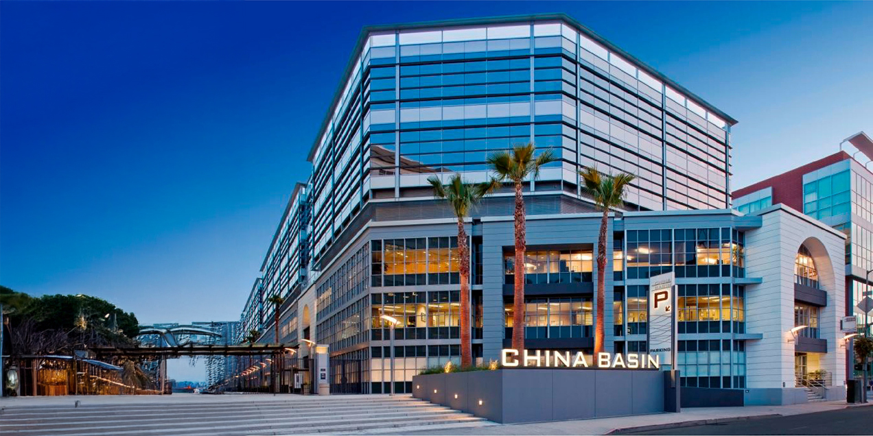 Exterior view of the China Basin medical building at 185 Berry Street in San Francisco, showing the building facade and illuminated China Basin signage.