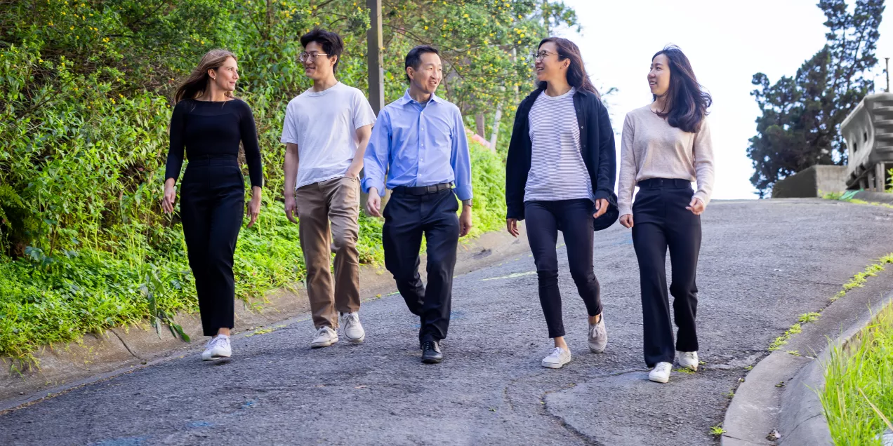 students walking with professor