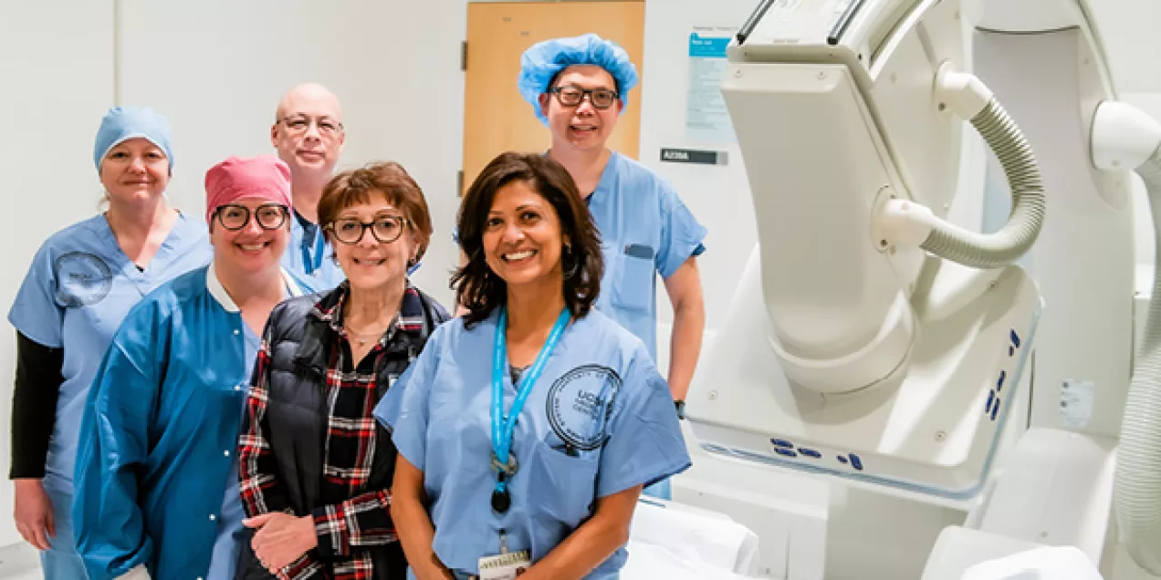 Left to Right- back to front: Amber Cravens- IR NP, Chester Lim- RT supervisor, Joseph Go- IR technologist, Heather Canella- IR technologist, Janet Dolinsky- IR admin, Alpana Patel Camilli- manager BIR/NES