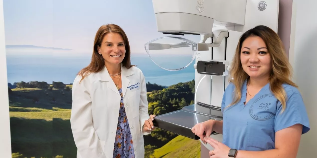 Breast imaging radiologist and technologist with mammography scanner.