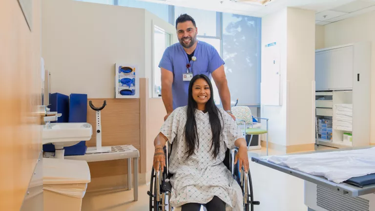 Patient in wheelchair smiling