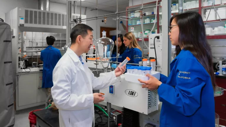 Researchers collaborating in the lab