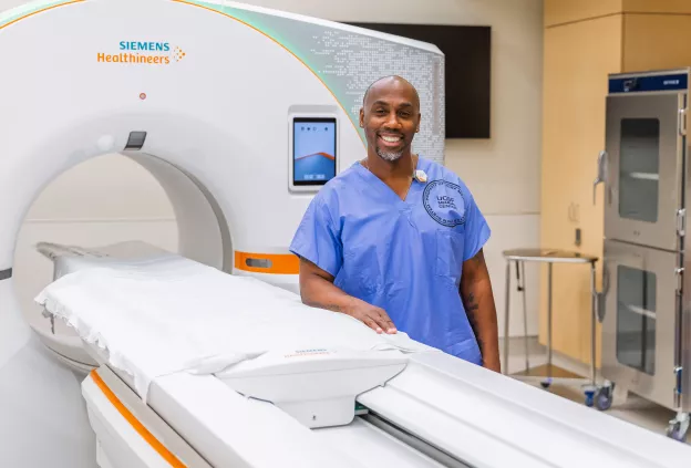 UCSF Health Radiology team member with CT scanner in the ER