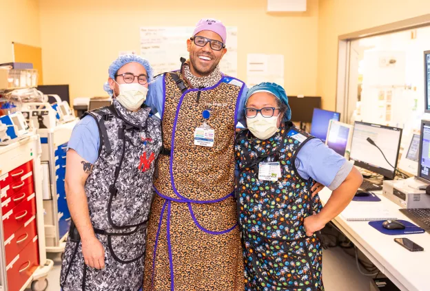 Employees wearing lead shield vests.