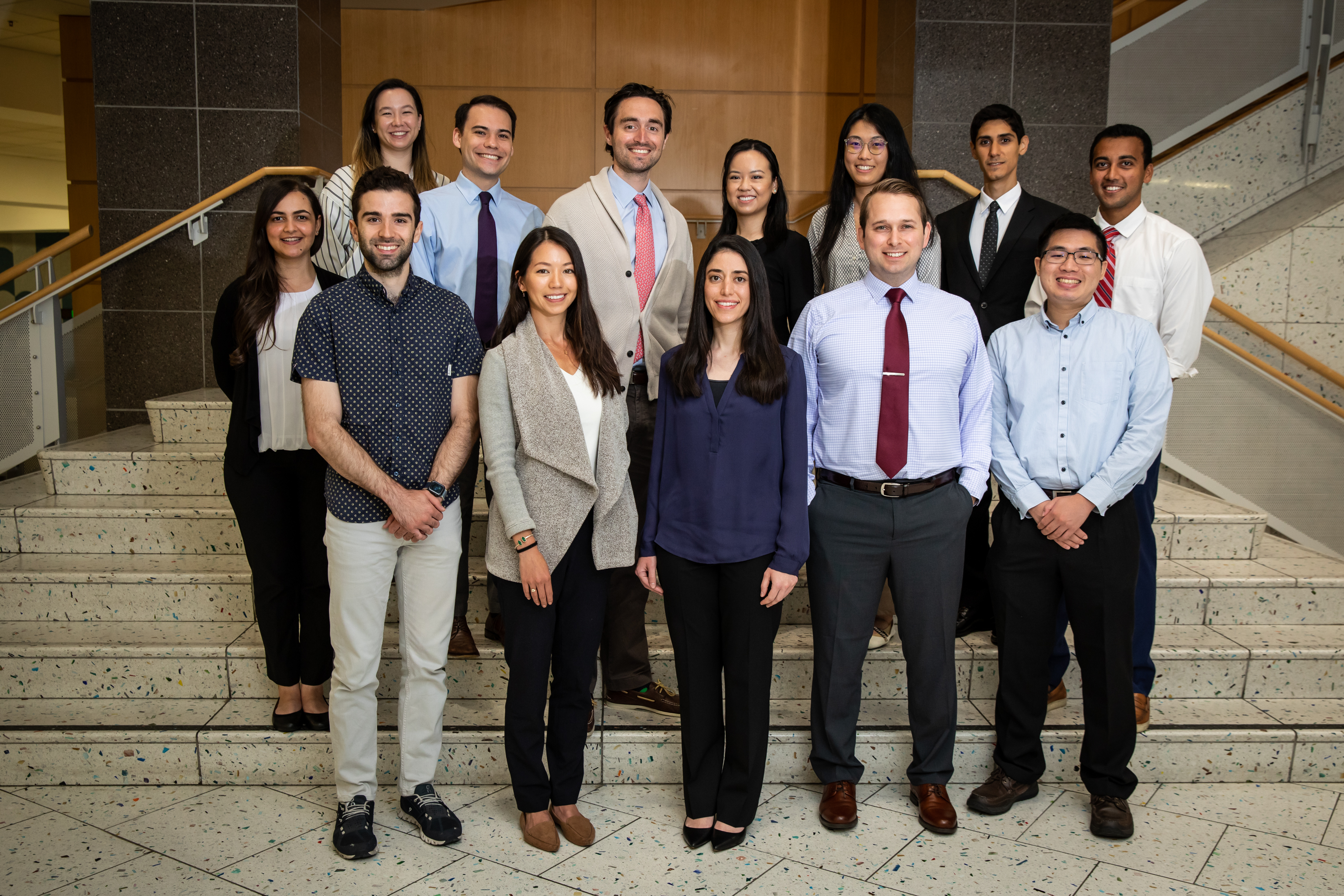 Group photo of the Radiology Residents Class of 2026 standing on indoor steps.