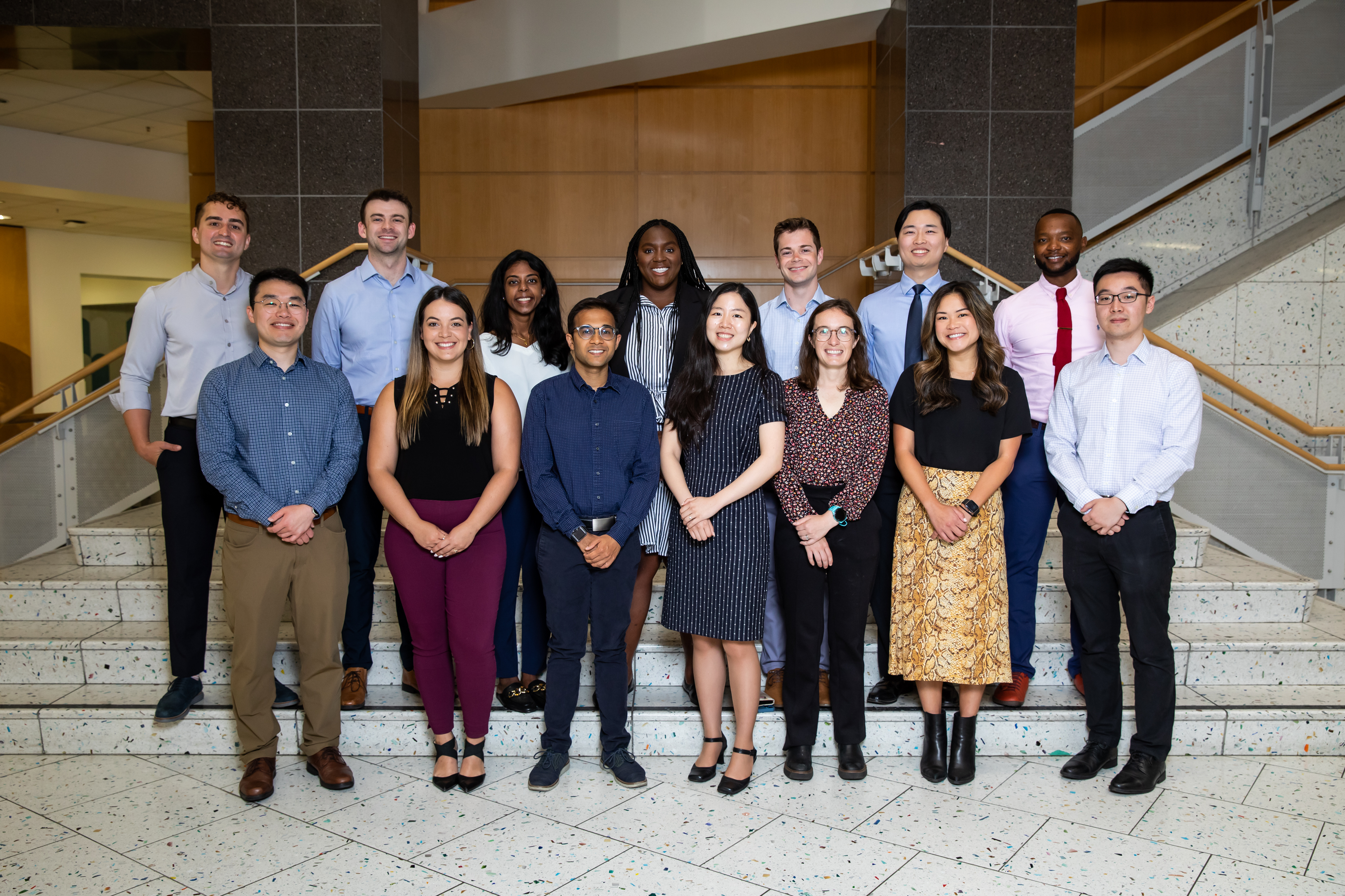 Group photo of the Radiology Residents Class of 2028 standing on indoor steps.